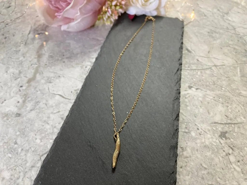 Miniature Gold Molokhia Seed Pod Pendant Cocorose London